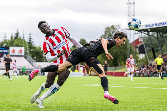 Abubacarr Sedi Kinteh of Tromsø and Ulrik Mathisen of Brann