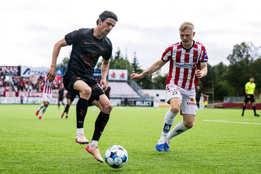 Ulrik Mathisen of Brann and Runar Norheim of Tromsø