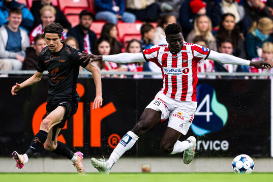 Ulrik Mathisen of Brann and Abubacarr Sedi Kinteh of Tromsø