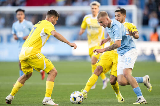 Filip Slavicek of SK Sigma Olomouc and Daniel Gudjohnsen of