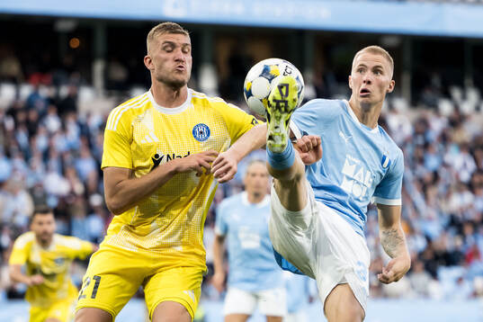 Jan Kral of SK Sigma Olomouc and Daniel Gudjohnsen of