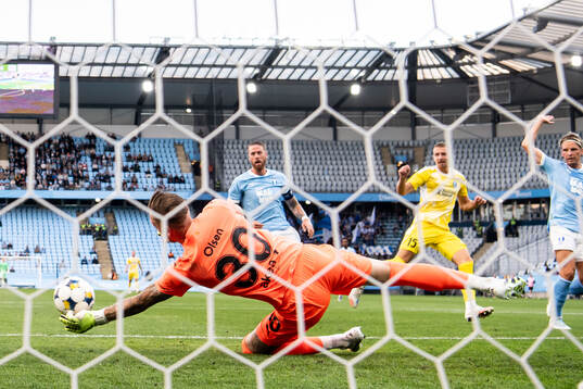 Goalkeeper Robin Olsen of Malmö FF makes a save against