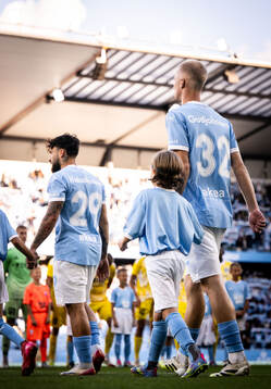 Sead Haksabanovic and Daniel Gudjohnsen of Malmö FF enter