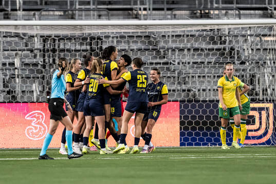 Daryna Apanaschenko of Metalist 1925 celebrates with