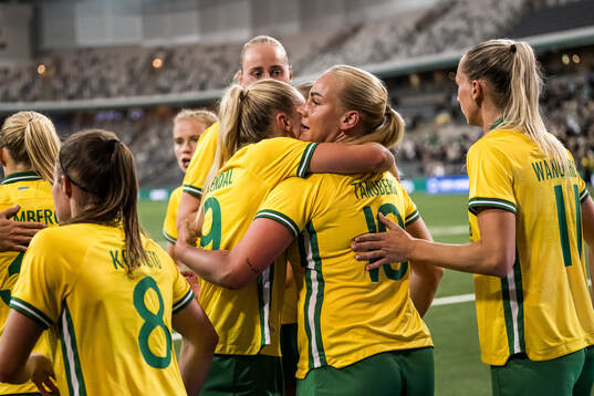Cathinka Tandberg  of Hammarby celebrates with teammates