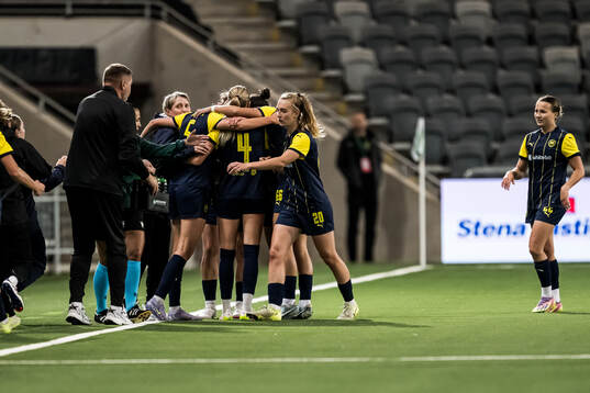 Veronika Andrukhiv of Metalist 1925 celebrate with teammates