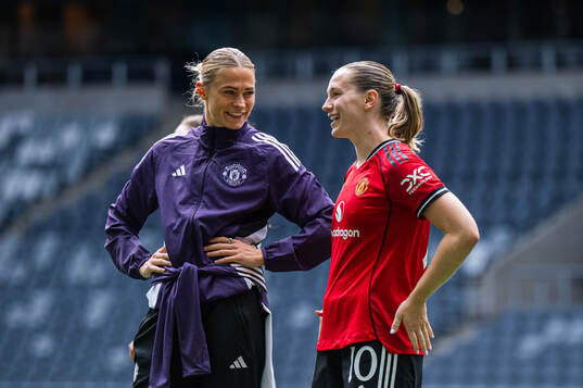 Fridolina Rolfö and Elisabeth Terland of Manchester United
