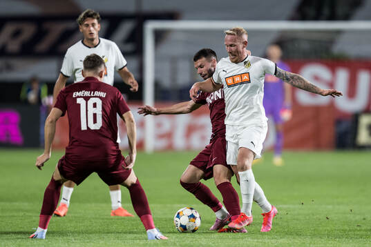 Andrei Cordea of CFR Cluj and Mikkel Rygaard Jensen of