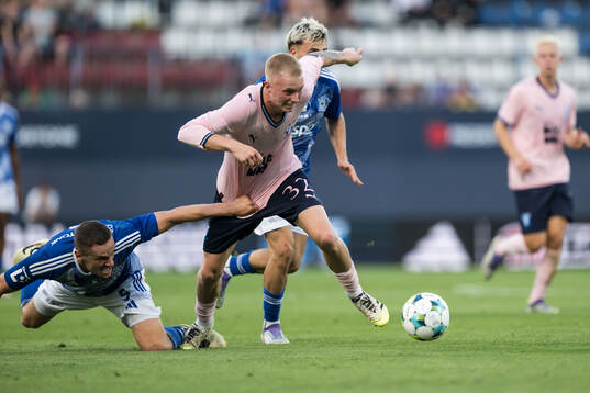 Tomas Huk of SK Sigma Olomouc and Daniel Gudjohnsen of