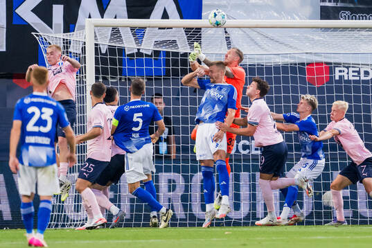 Daniel Vasulin of SK Sigma Olomouc and Goalkeeper Robin