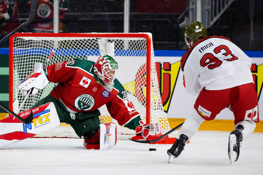 Goaltender Tobias Normann of Frölunda and Luca Frigo of