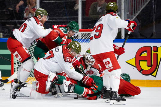 Goaltender Samuel Harvey and Matthew James Bradley of