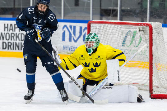 Jesse Pahkamaa of Finland and Goaltender Fabian Nääs