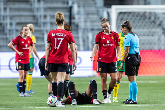 Elisabeth Terland of Manchester United reacts next to Jayde