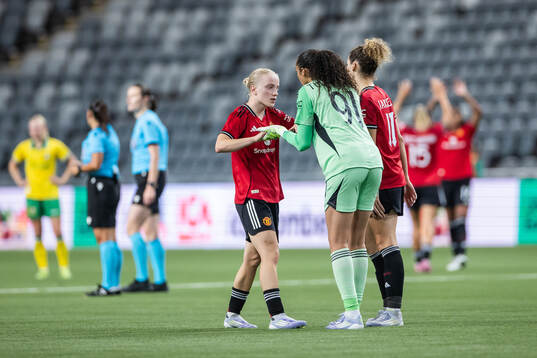 Anna Sandberg and goalkeeper Phallon Tullis-Joyce of