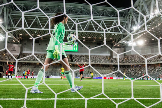 Goalkeeper Phallon Tullis-Joyce of Manchester United olds