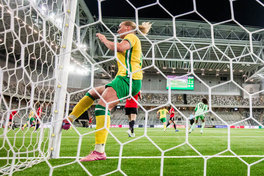 Cathinka Tandberg of Hammarby kicks the goal post