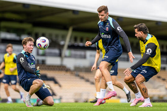 Goalkeeper Mathias Dyngeland and Alexander Sørloth of the