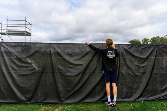 A spectator watching the training session from outside the