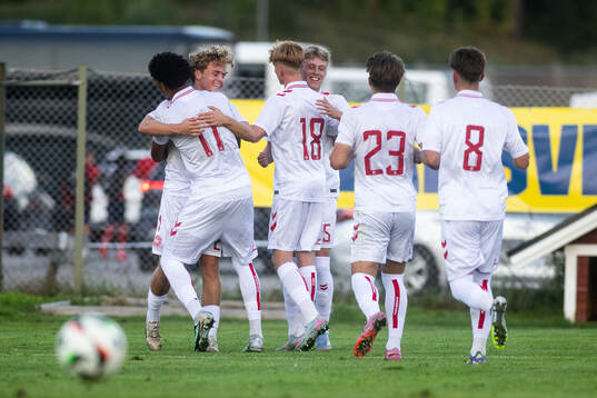 Viggo Poulsen of Denmark celebrates with teammates