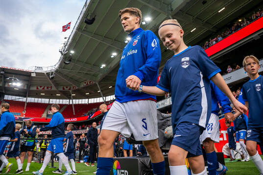 David Møller Wolfe of Norway enters the pitch