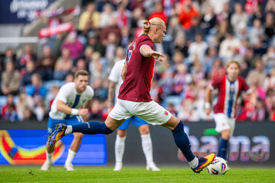 Erling Braut Haaland of Norway scores the 1-0 goal with a