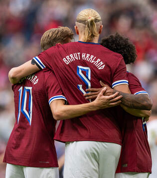 Erling Braut Haaland of Norway celebrates with teammates