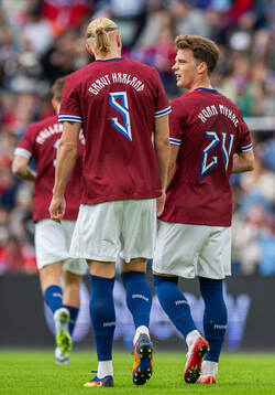 Erling Braut Haaland of Norway with teammate Felix Horn