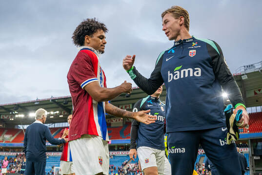 Oscar Bobb and goalkeeper Mathias Dyngeland of Norway