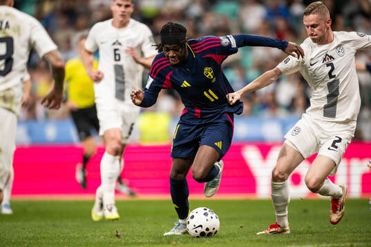Anthony Elanga of Sweden and Žan Karnicnik of Slovenia
