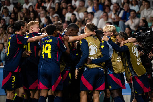 Yasin Ayari of Sweden celebrates with teammates