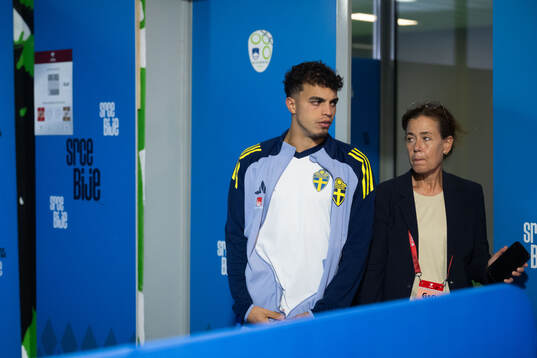 Yasin Ayari and press officer Petra Thorén of Sweden in
