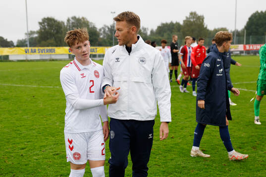 Johan Hvistendahl and headcoach Morten Mölkjaer celebrates