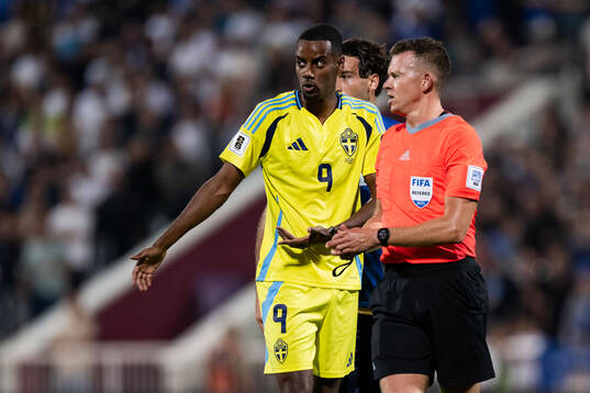 Alexander Isak of Sweden reacts against referee Allard