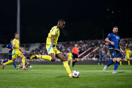 Alexander Isak of Sweden and Fidan Aliti of Kosovo