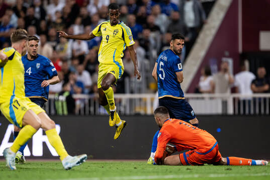 Alexander Isak of Sweden and goalkeeper Arijanet Muric of