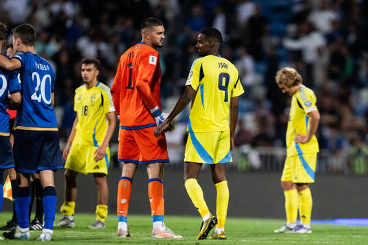 Goalkeeper Arijanet Muric of Kosovo and Alexander Isak of