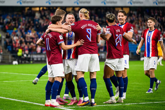 Felix Horn Myhre of Norway celebrate with teammates