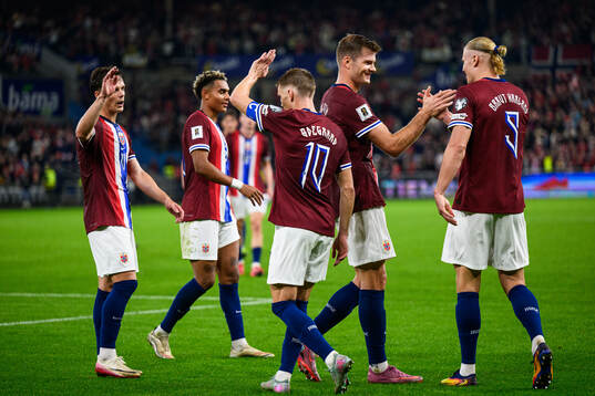 Erling Braut Haaland of Norway celebrates with teammates