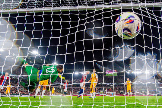 Erling Braut Haaland of Norway scores the 6-0 goal behind