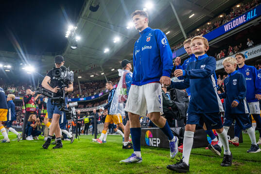 David Møller Wolfe of Norway enters the pitch