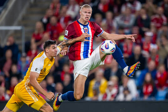 Artur Craciun of Moldova and Erling Braut Haaland of Norway