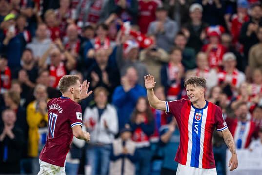 Martin Ødegaard and David Møller Wolfe of Norway celebrate