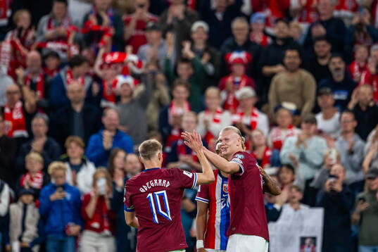 Erling Braut Haaland of Norway celebrates with teammate