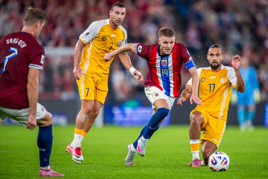 Martin Ødegaard of Norway and Virgiliu Postolachi of