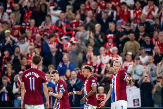 Erling Braut Haaland of Norway celebrates with teammates