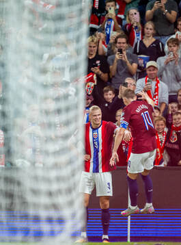 Erling Braut Haaland of Norway celebrates with teammate