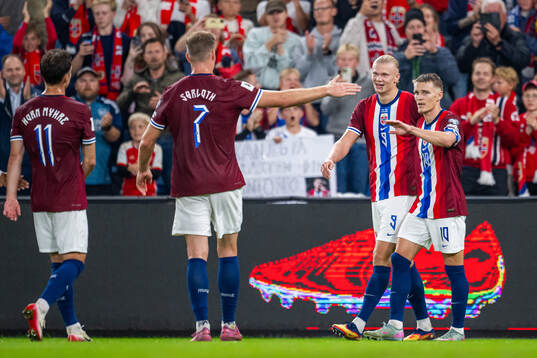 Erling Braut Haaland of Norway celebrates with teammates