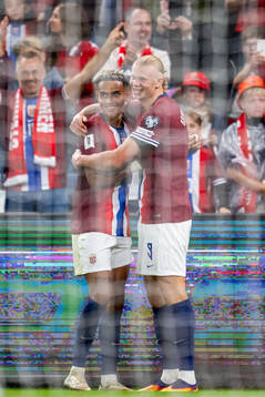 Erling Braut Haaland of Norway celebrates with teammate