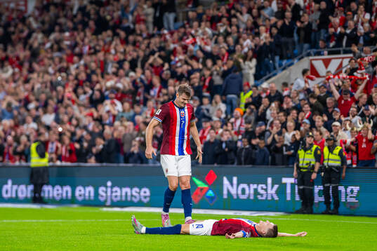 Martin Ødegaard of Norway celebrates with teammate